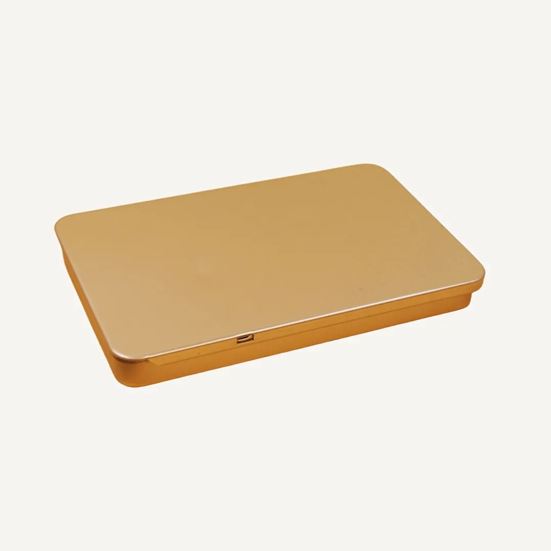 Flat rectangular gold tin box closed view