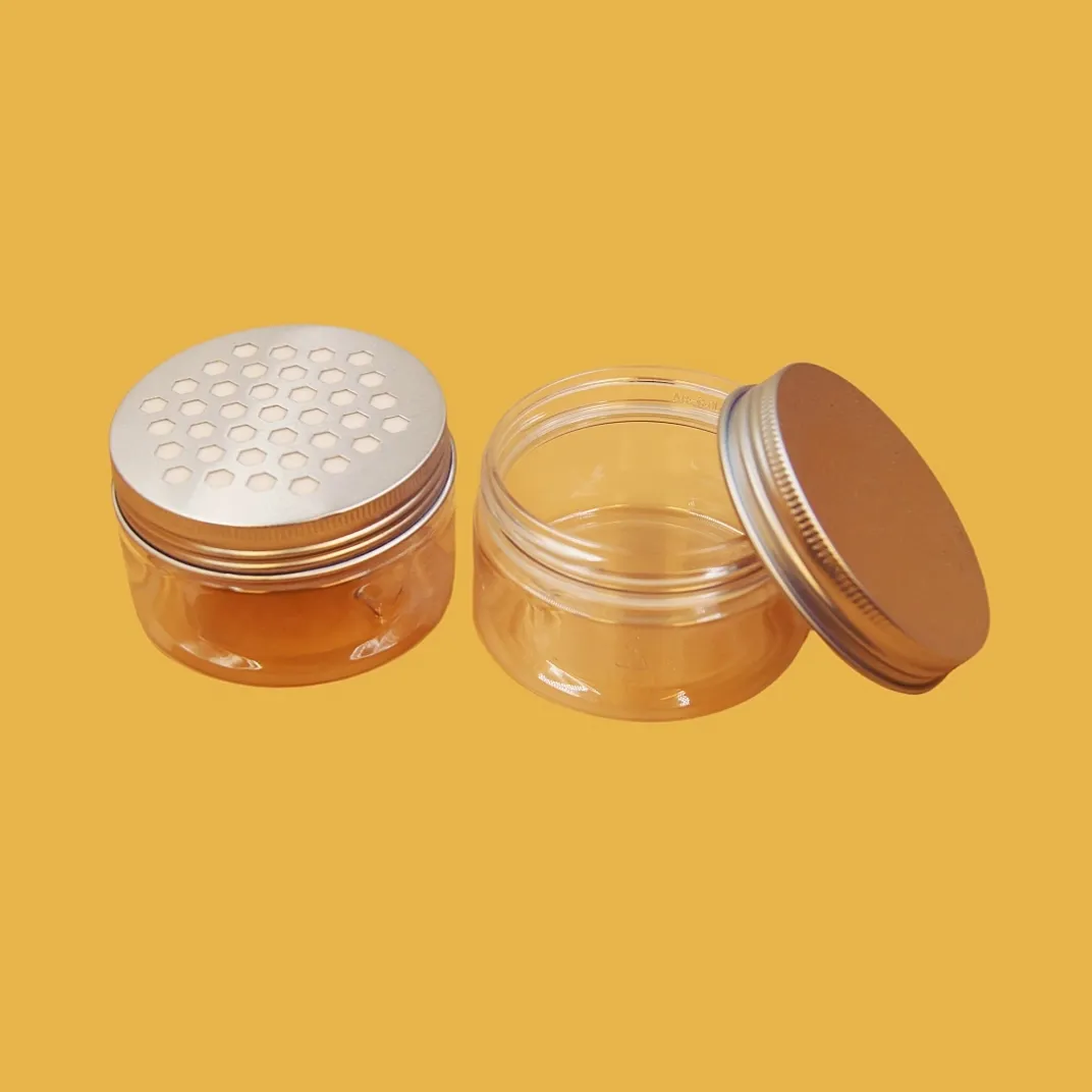 open small round clear lid tin containers with transparent lids and gold metal bases