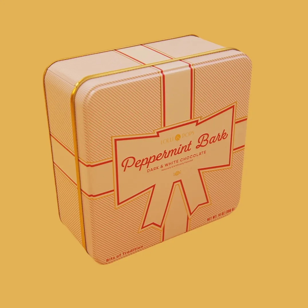 pink gift box shaped tin box side view with ribbon artwork and custom printed surface
