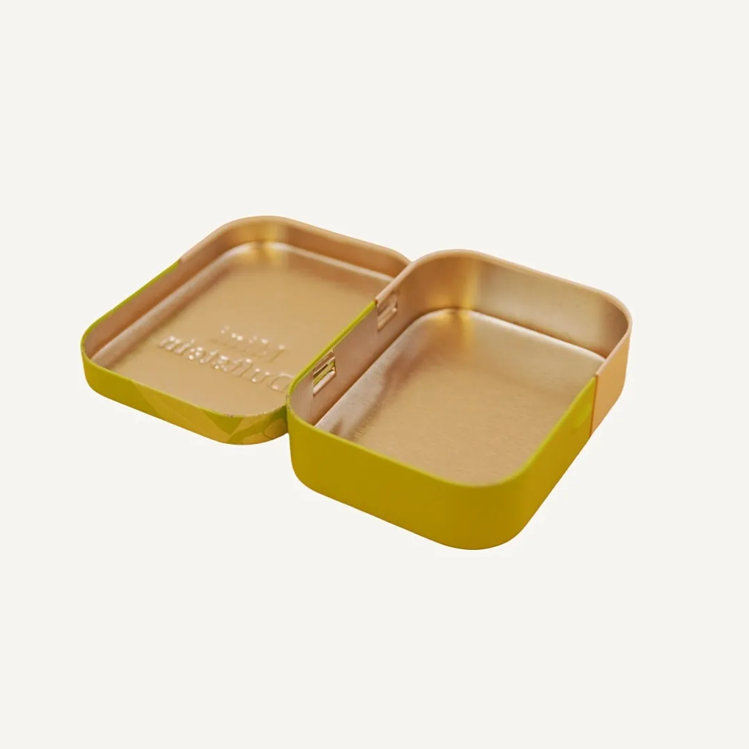 Open green rectangular hinged candy tin box