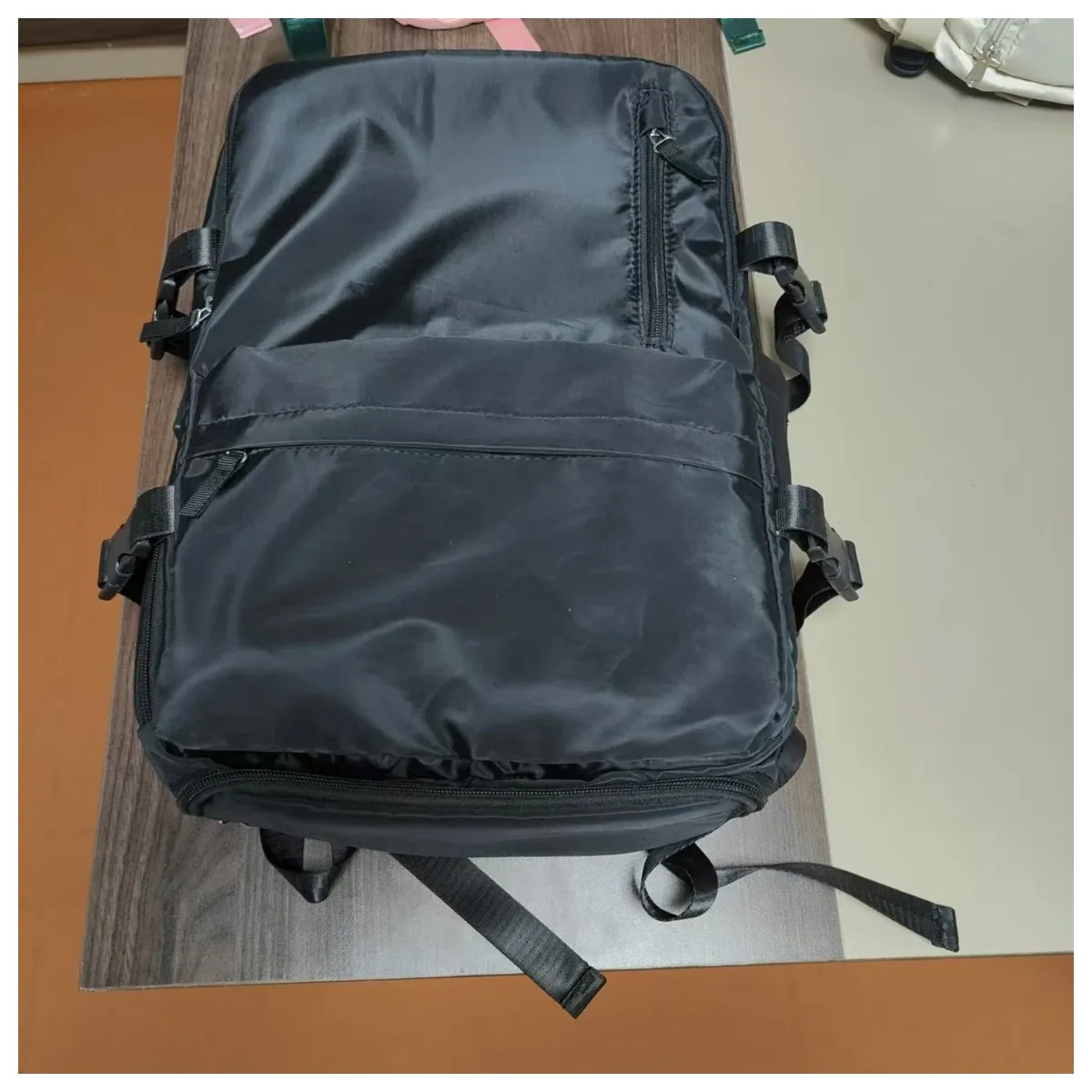 Grey travel backpack with clamshell opening