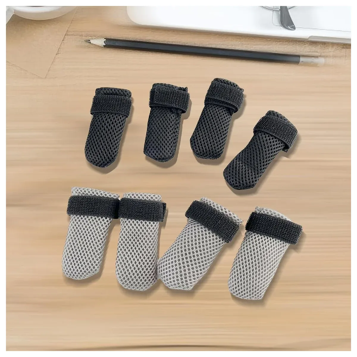 Four dog grip socks on a table