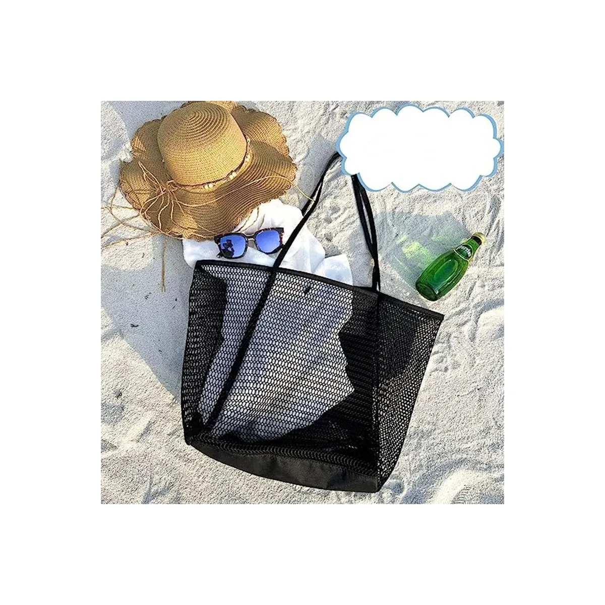 Black mesh beach tote on sand with hat and sunglasses