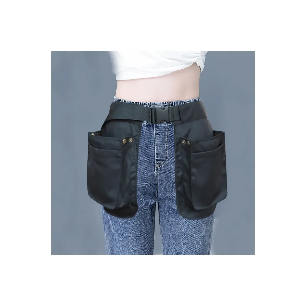 Black multi-pocket waist apron worn with jeans