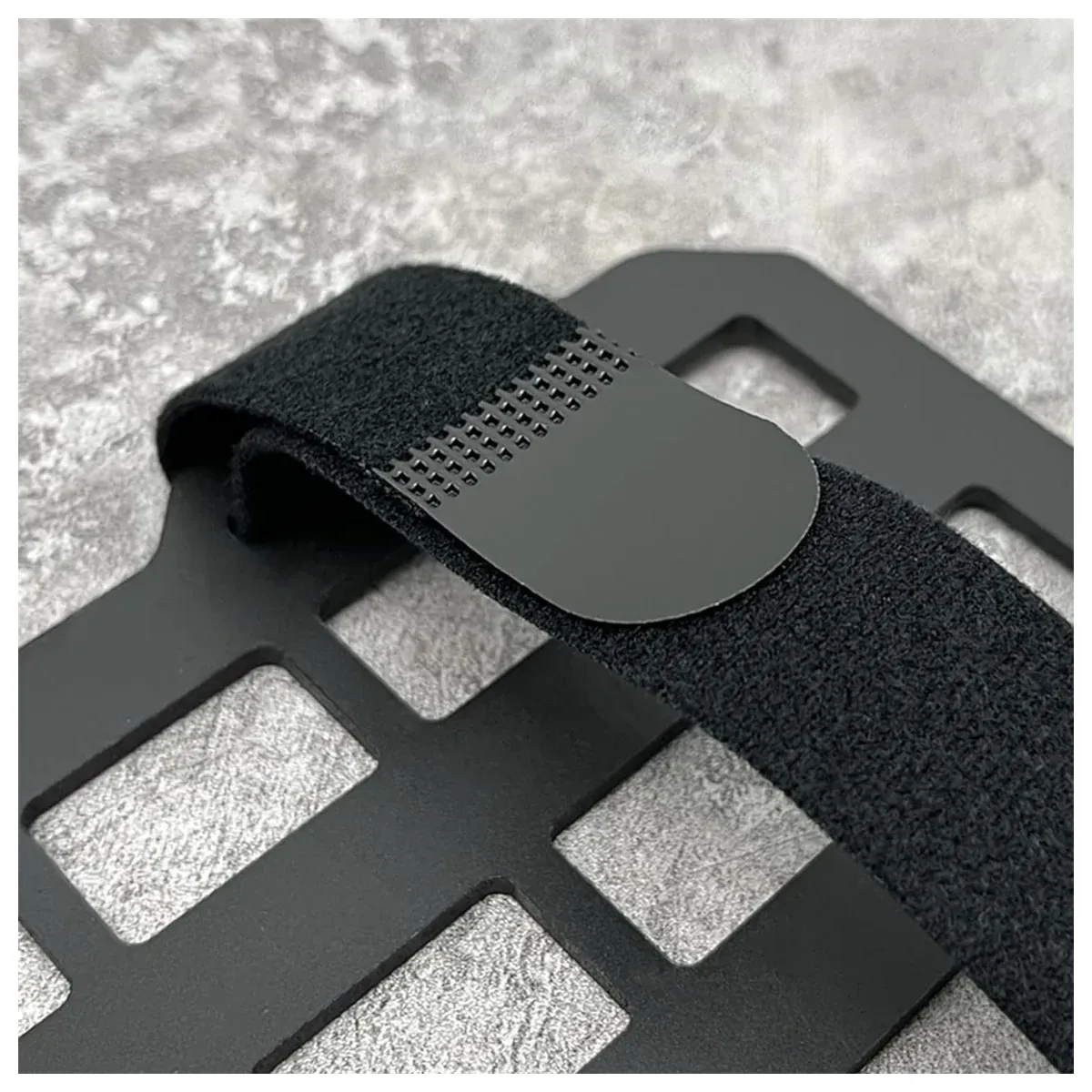 Hook-and-loop strap on a car visor organizer panel