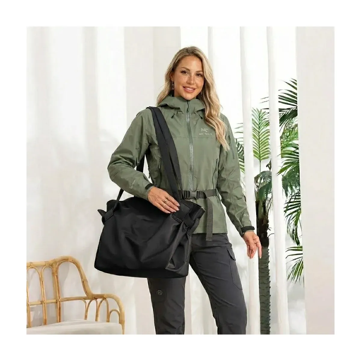 Large black nylon camping tote carried over the shoulder