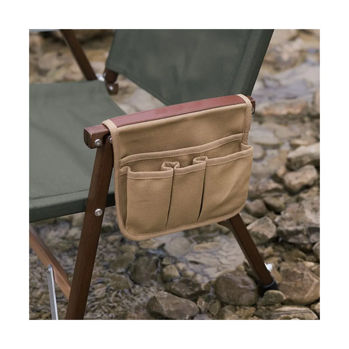 Camping chair side pocket hanging on an armrest
