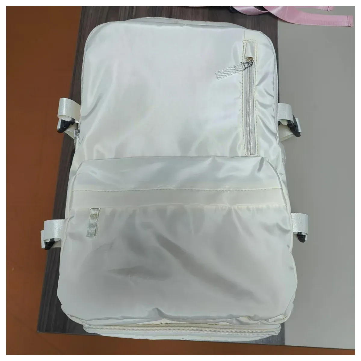 White travel backpack with trolley sleeve