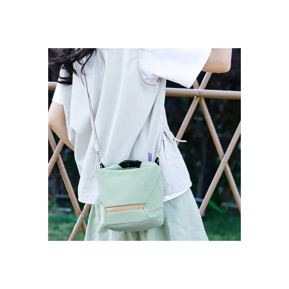 Camera sling bag worn across the body