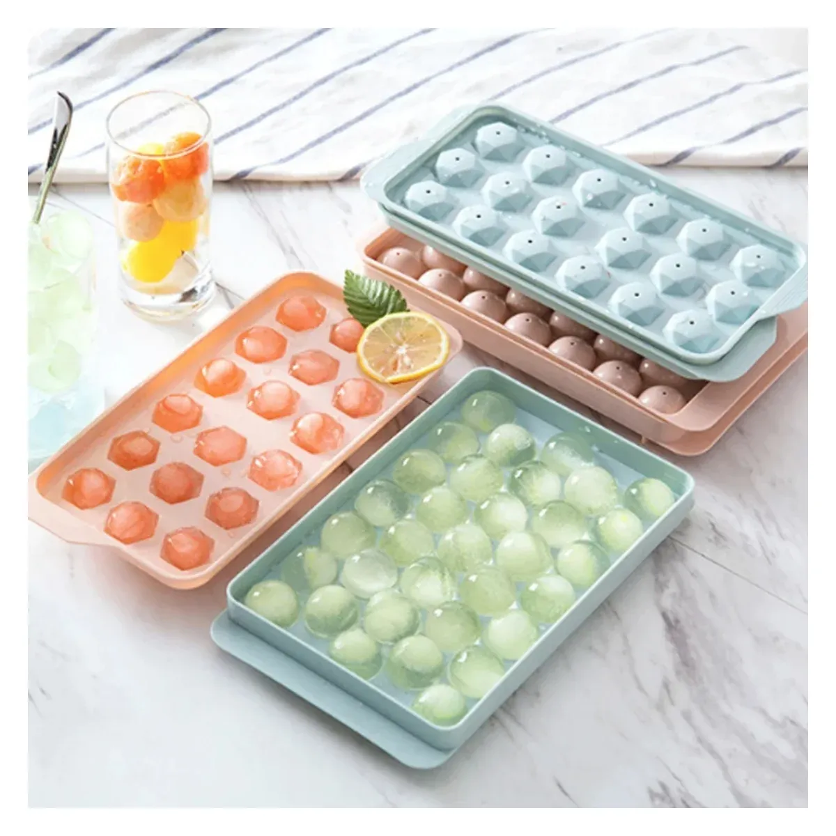 Ice ball trays with drinks and fruit