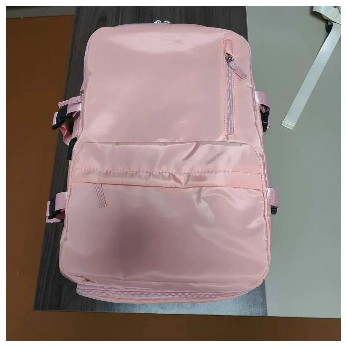 Black travel backpack with shoe compartment