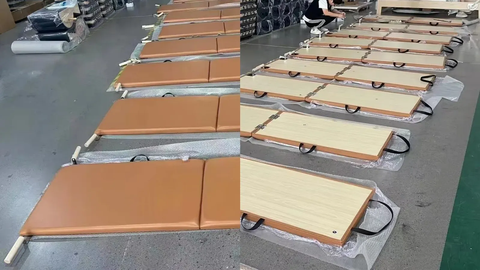 Brown Pilates folding mats on protective sheeting during inspection, shown from the upholstered face and the wooden underside with hinges and carry handles