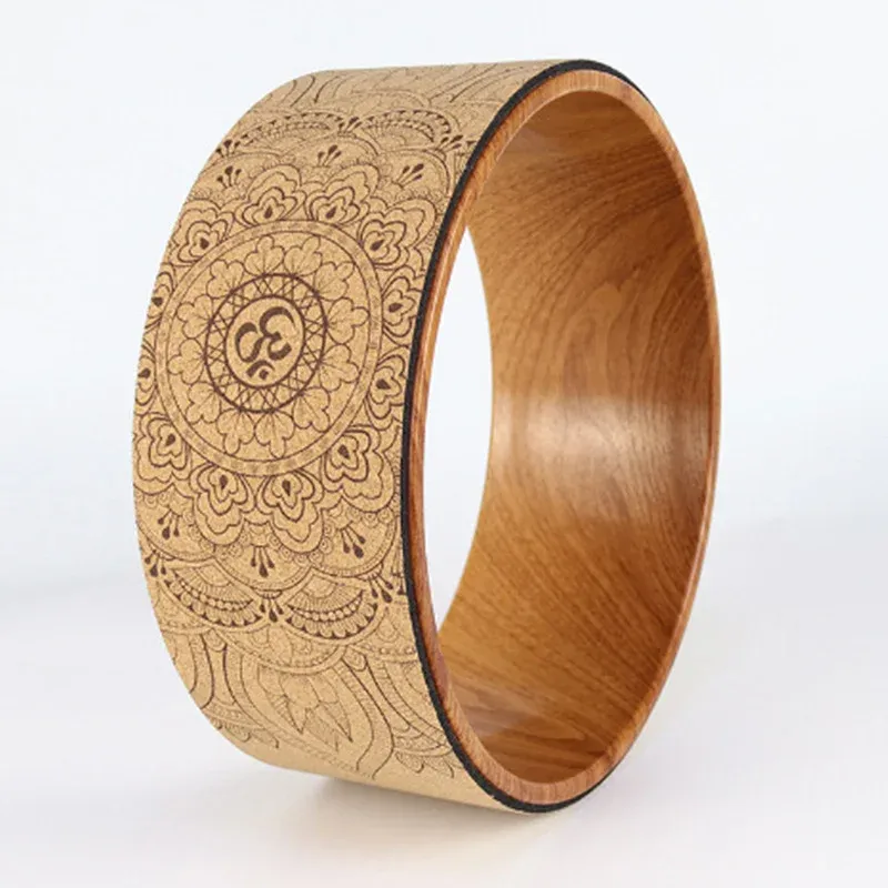 Cork yoga wheel with a custom printed mandala design on the natural cork band and a wood-grain inner rim