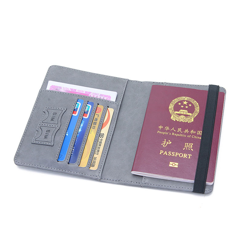 Open family passport holder with passport and cards