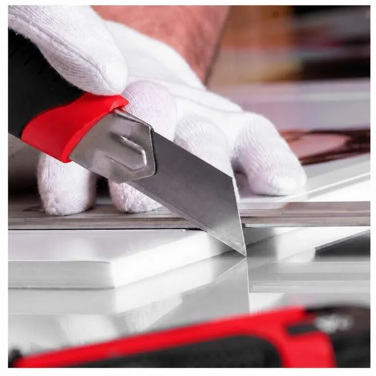 red-utility-knife-cutting-pvc-board