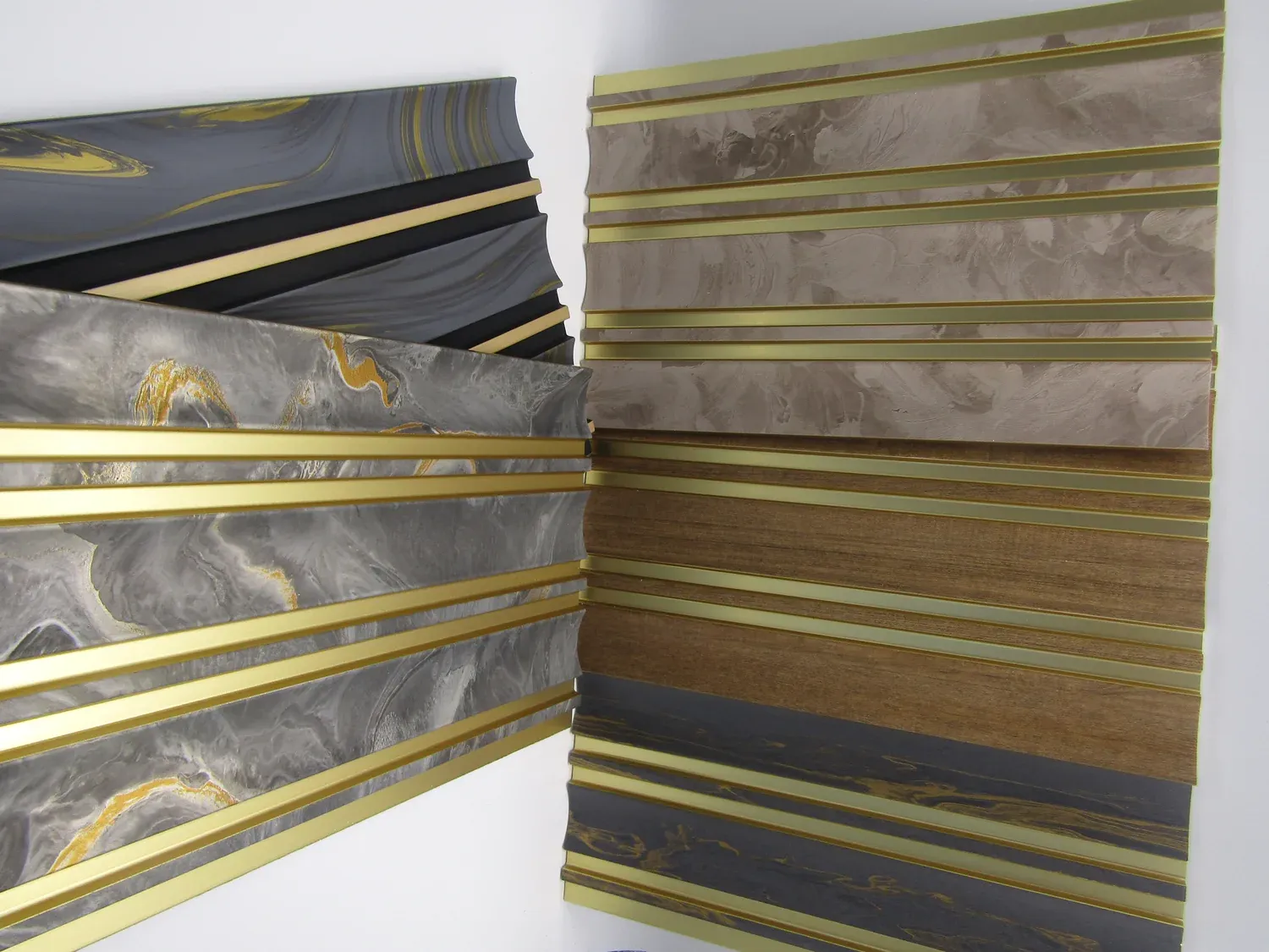 Six colourways of fluted wall panels with champagne gold metal inserts