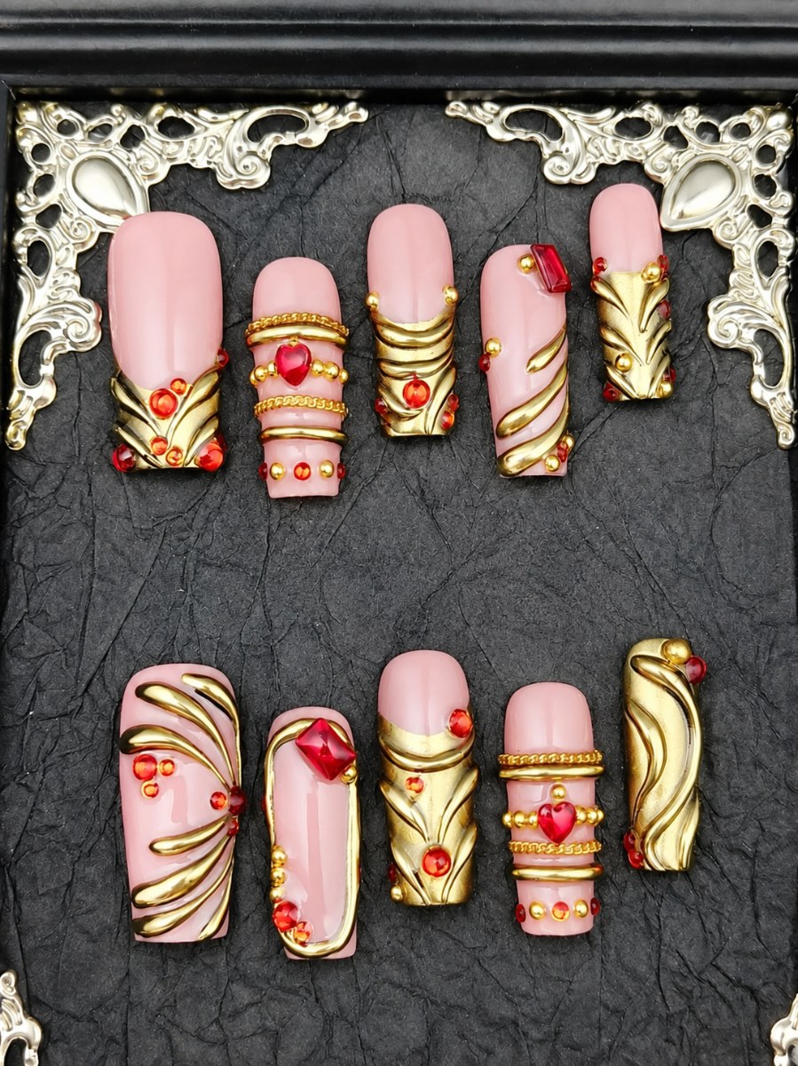 Baby pink coffin press-on nails with baroque gold relief and red crystal gems