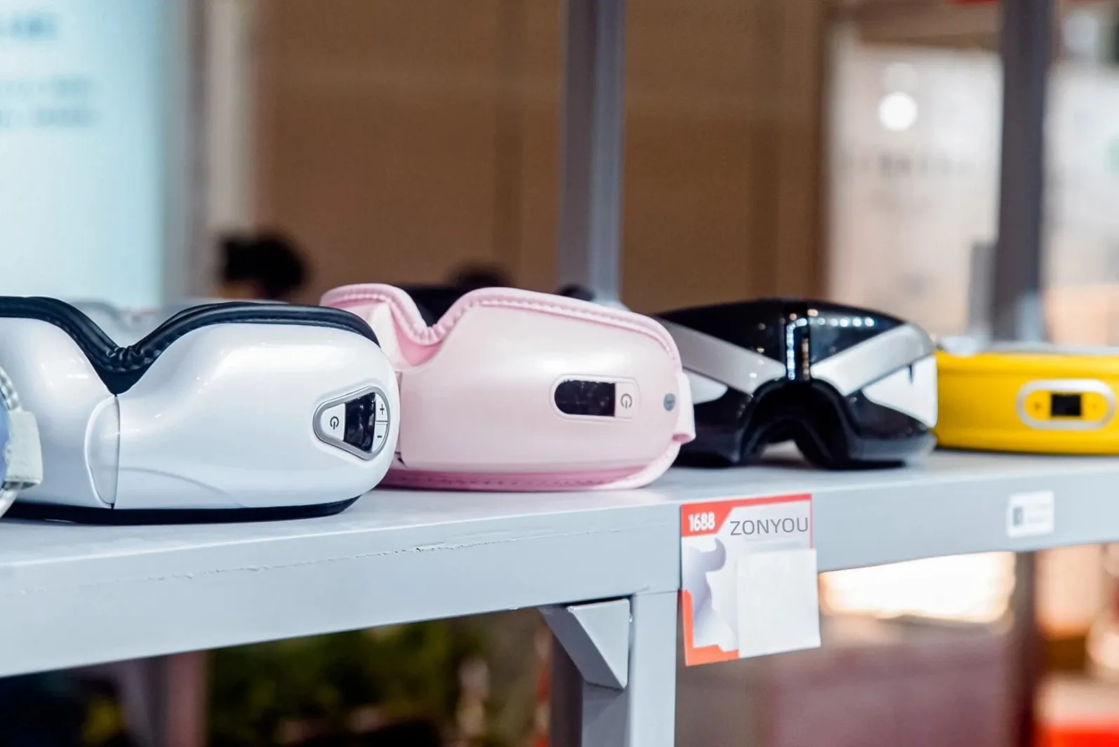 White Bluetooth eye massager with heat and air compression therapy, foldable design