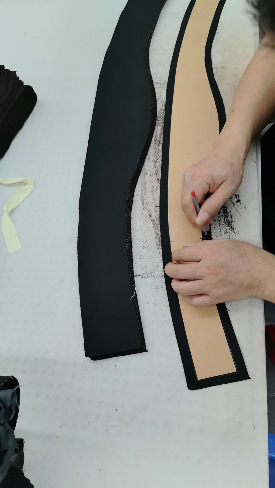 Pattern pieces being traced at our Shenzhen garment factory