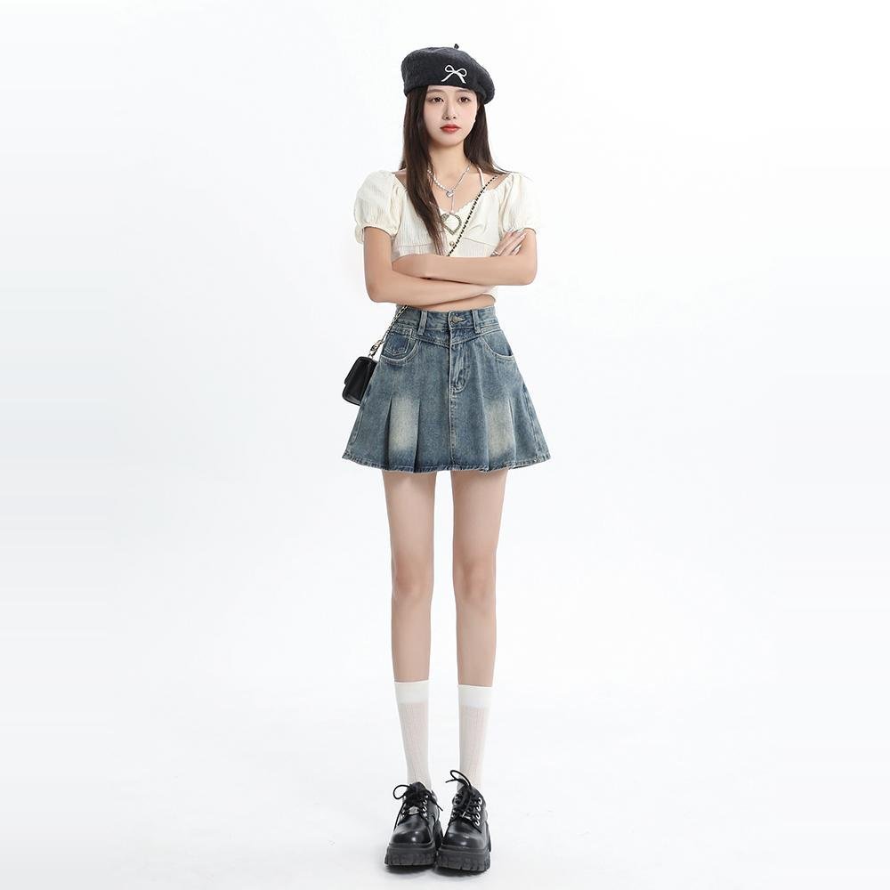 A-line denim mini skirt in stretch denim with raw edge detail, custom washes