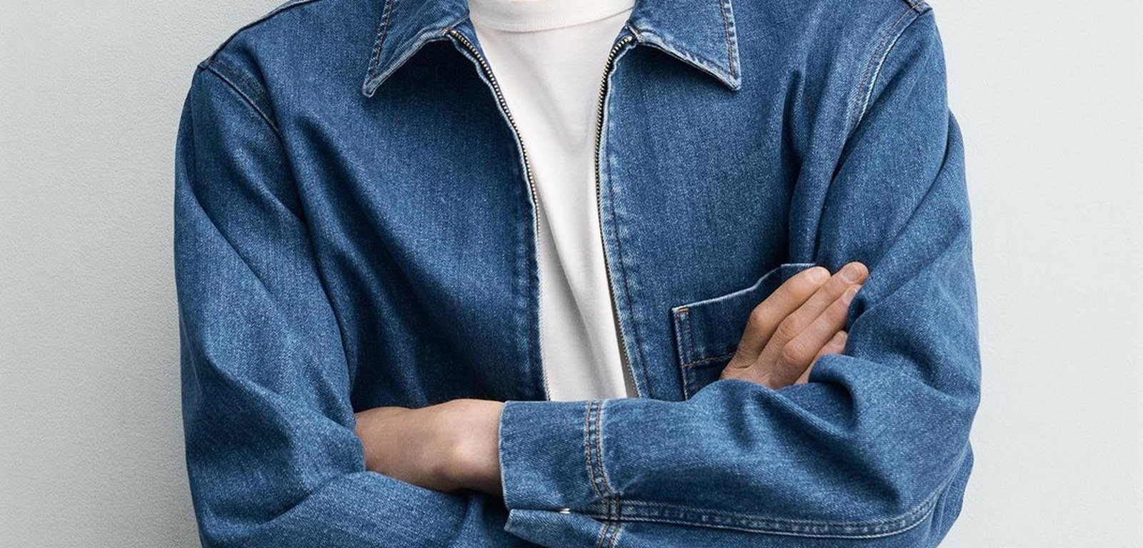 Denim jacket collar and chest detail showing wash and stitching