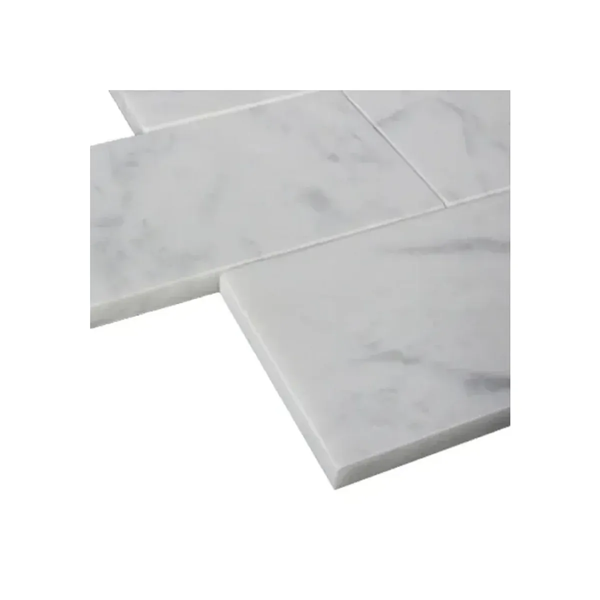 Close-up of Bianco Carrara White Marble 3x6 inch subway tile with natural grey veining