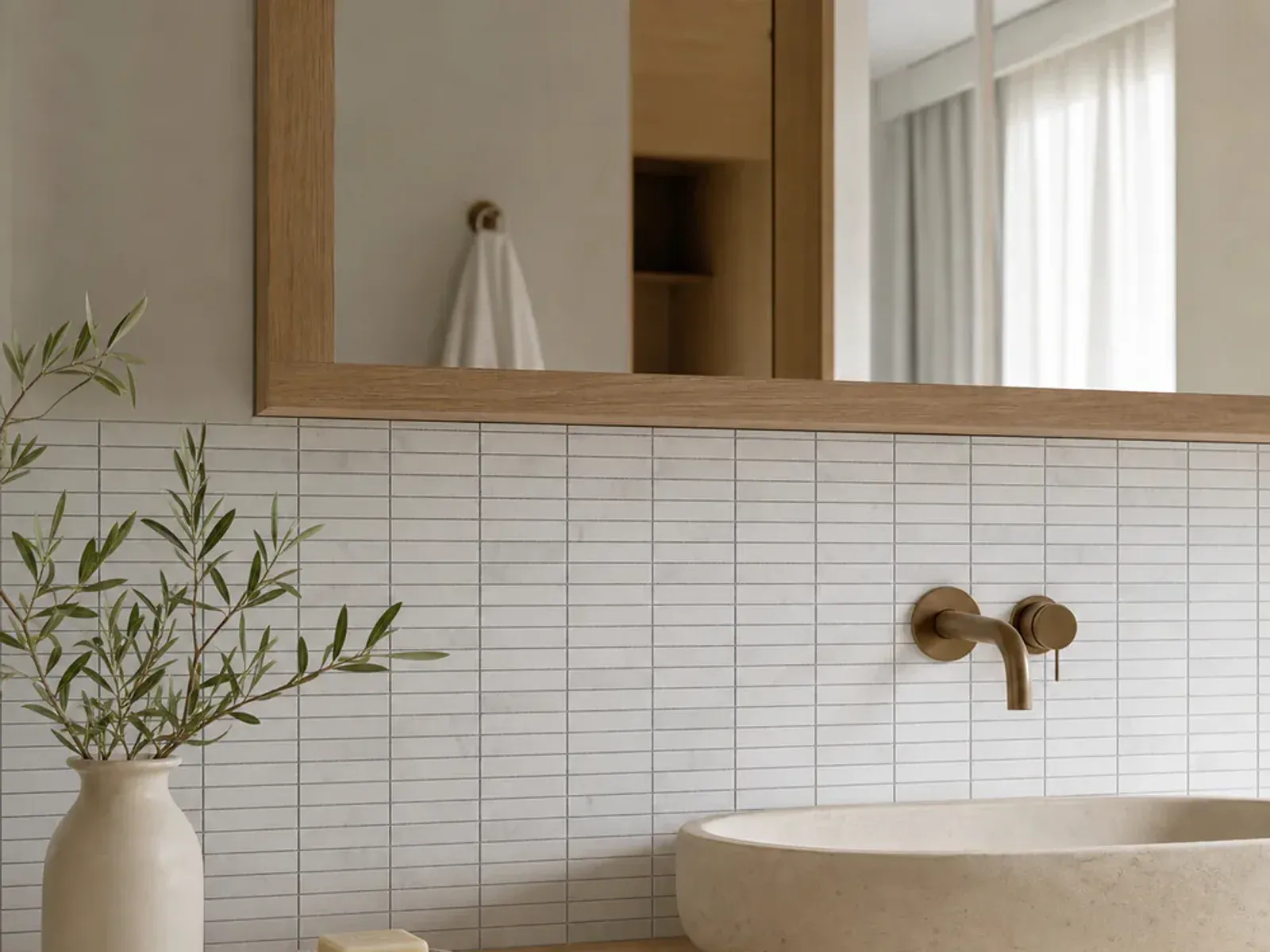 Carrara White Marble 5/8x2 Inch Rectangular Stacked Mosaic Tile installed in a bathroom wall application