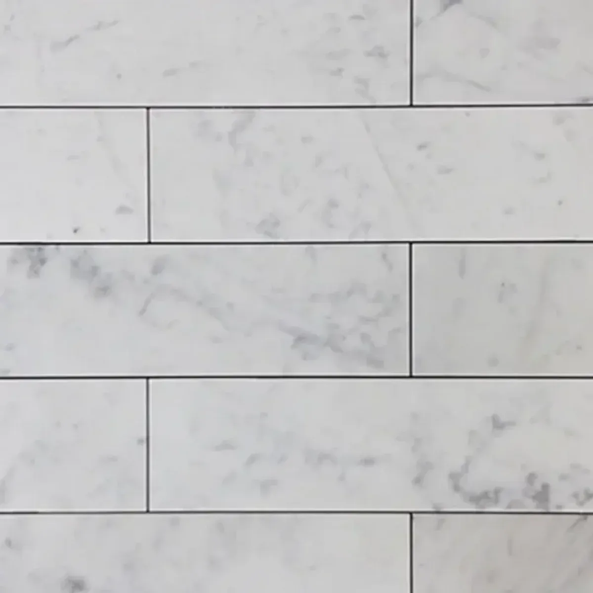 Bianco Carrara White Marble 3x12 inch subway tile showing natural grey veining