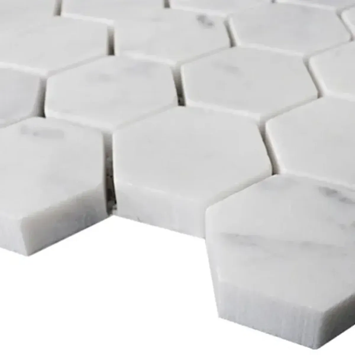 Detailed view of Carrara White Marble 1 Inch Hexagon Mosaic with natural grey veining