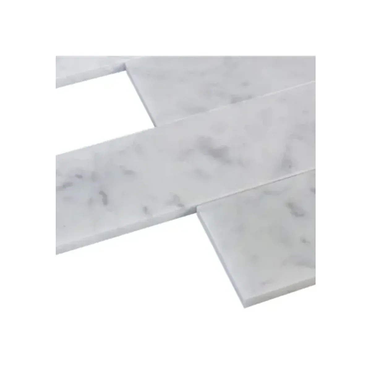 Close-up of Bianco Carrara White Marble 3x12 inch subway tile surface and edges