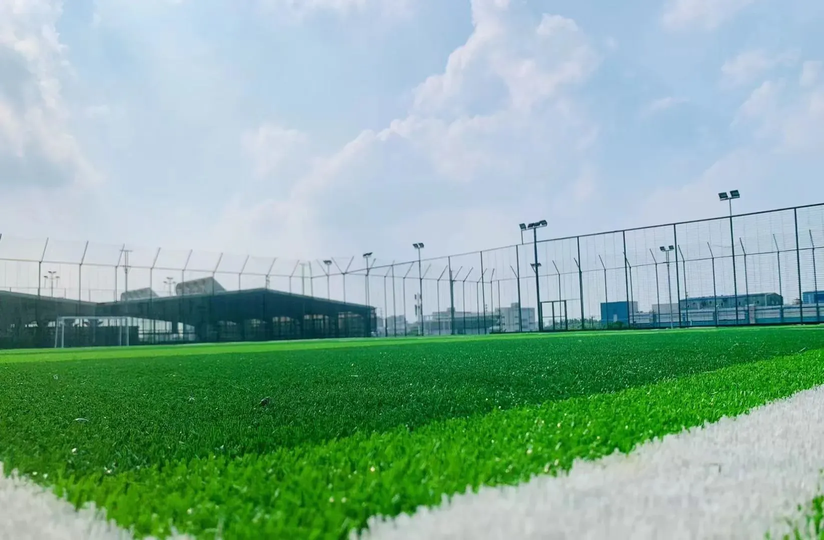 Artificial football pitch under floodlights