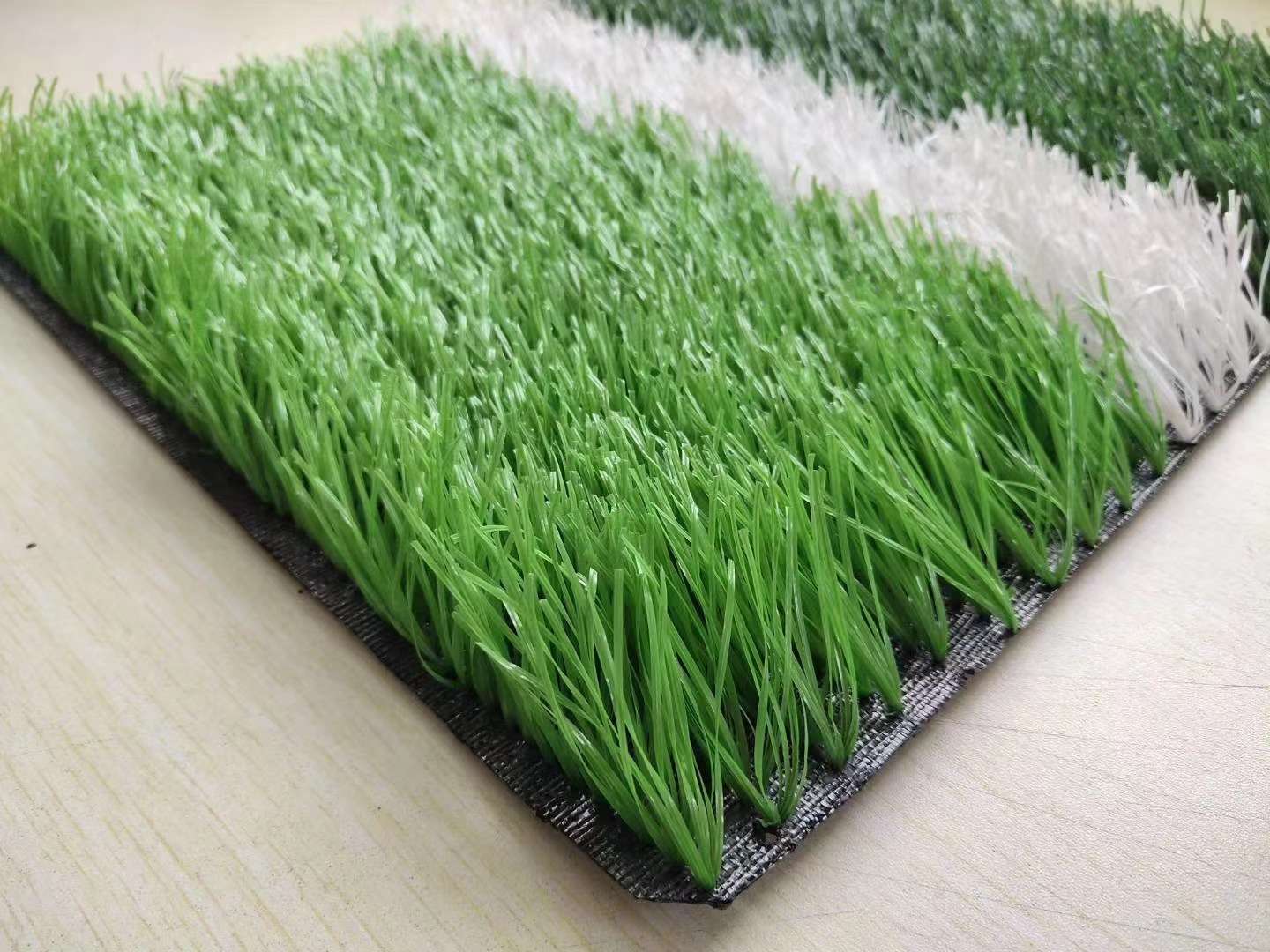 Infill artificial football turf with rubber granules