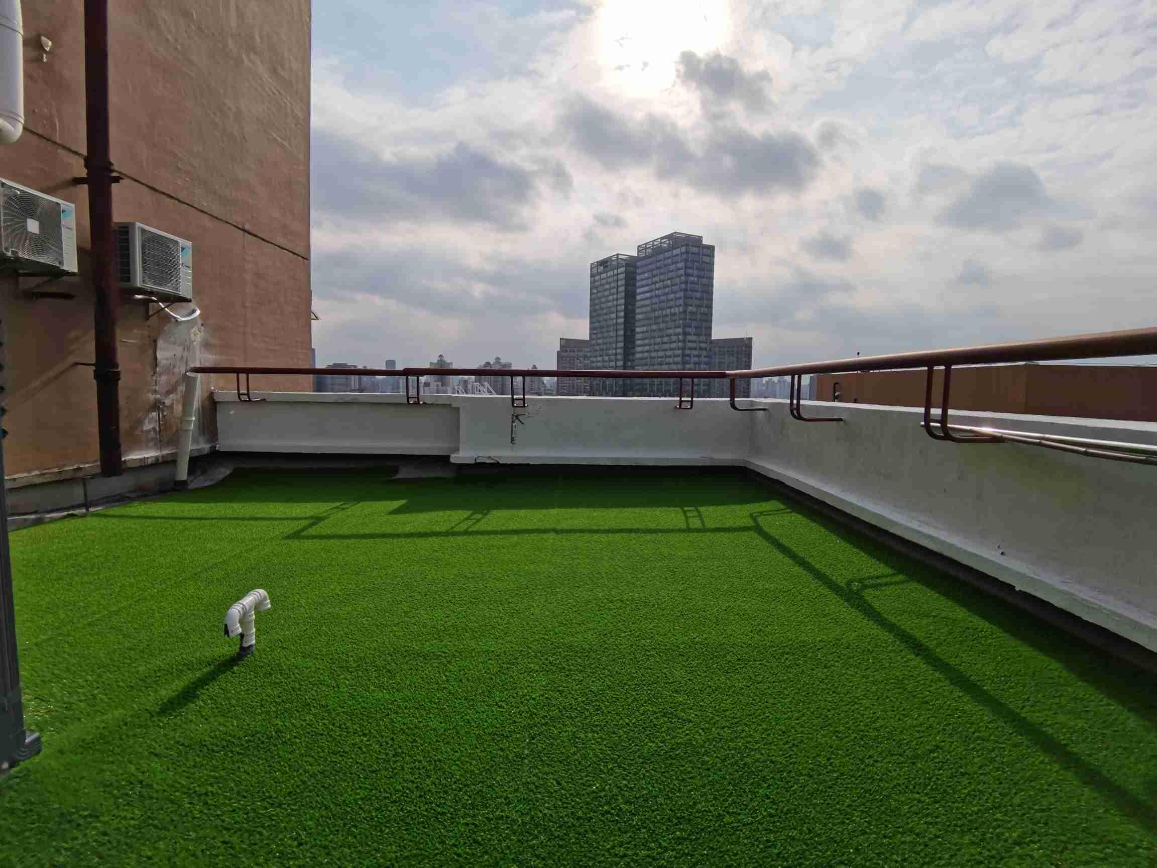 Artificial grass installed on a rooftop terrace