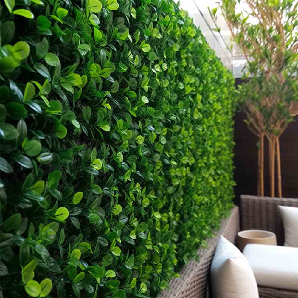 Artificial grass wall panel installed on an exterior wall