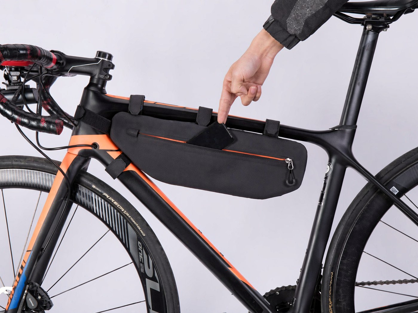 Black KY021 wedge top tube bag with orange zipper, mounted in the bike front triangle