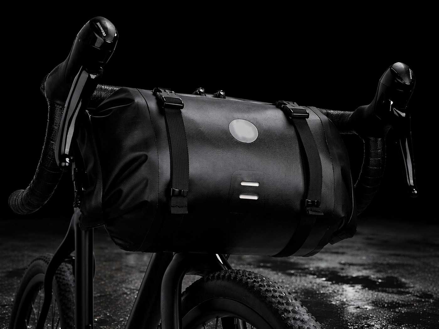 Black KY014 waterproof handlebar bag with white zipper lines, mounted on a road bike