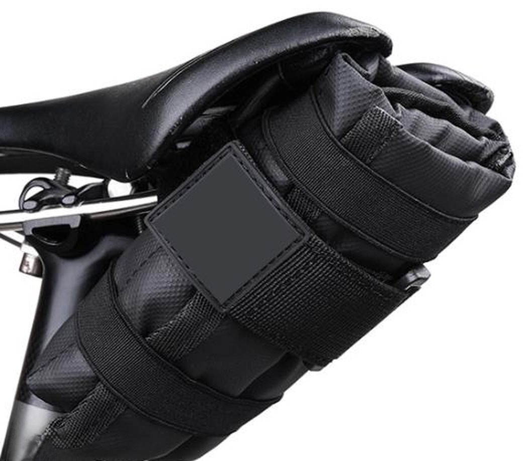 Black KY067 triangular tool bag mounted under a bicycle saddle
