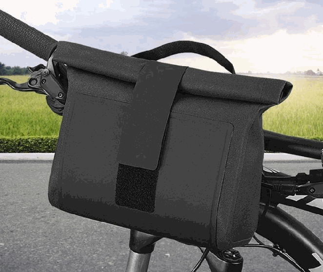 Black waterproof handlebar bag mounted on a bicycle