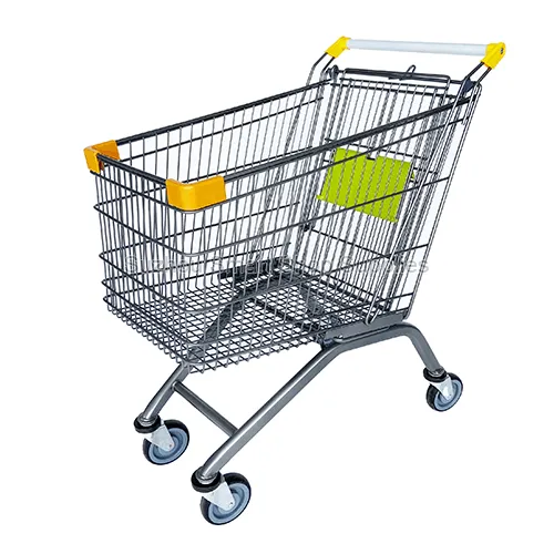 Angled view of the commercial-grade SMT-SC-A130L 130L Euro style wire shopping cart featuring a durable grey frame, vibrant yellow corner bumpers, and a green child seat by