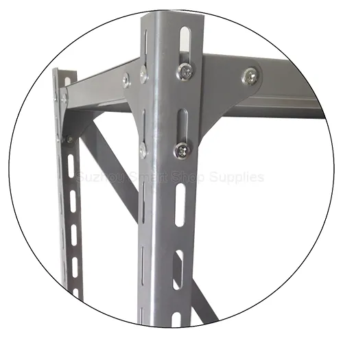 Close-up of SMT-ASR03 slotted angle iron post showing corner triangle gusset plating and industrial bolt connection mechanics