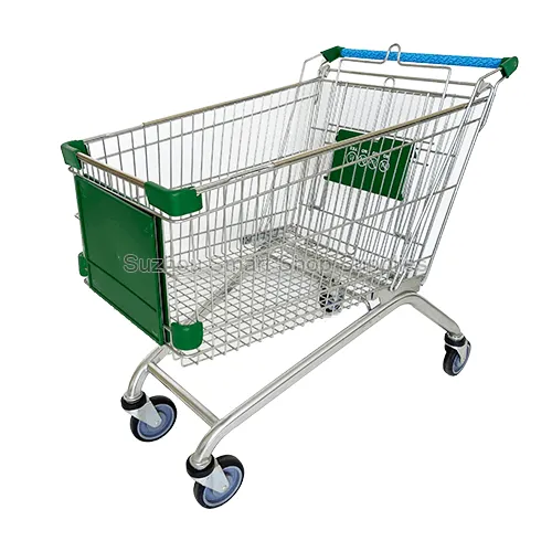 Angled view of the jumbo SMT-SC-A165L 165L Euro style wire shopping cart featuring a large green front logo panel, a safety-printed child seat, four corner bumpers, and a blue handle grip by Su