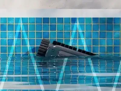 Y50S robot scrubbing the pool waterline