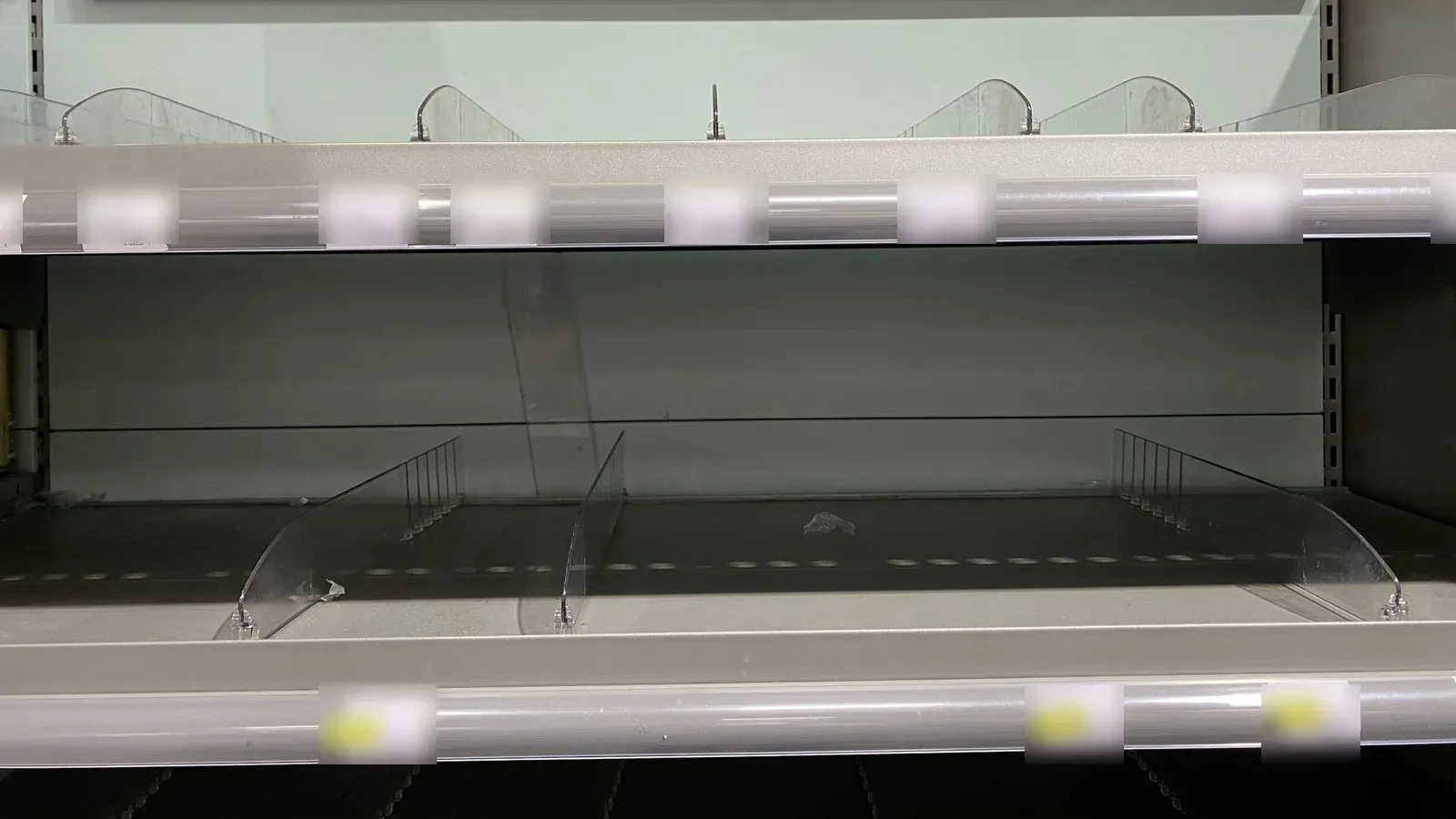 Empty store shelves waiting for new stock