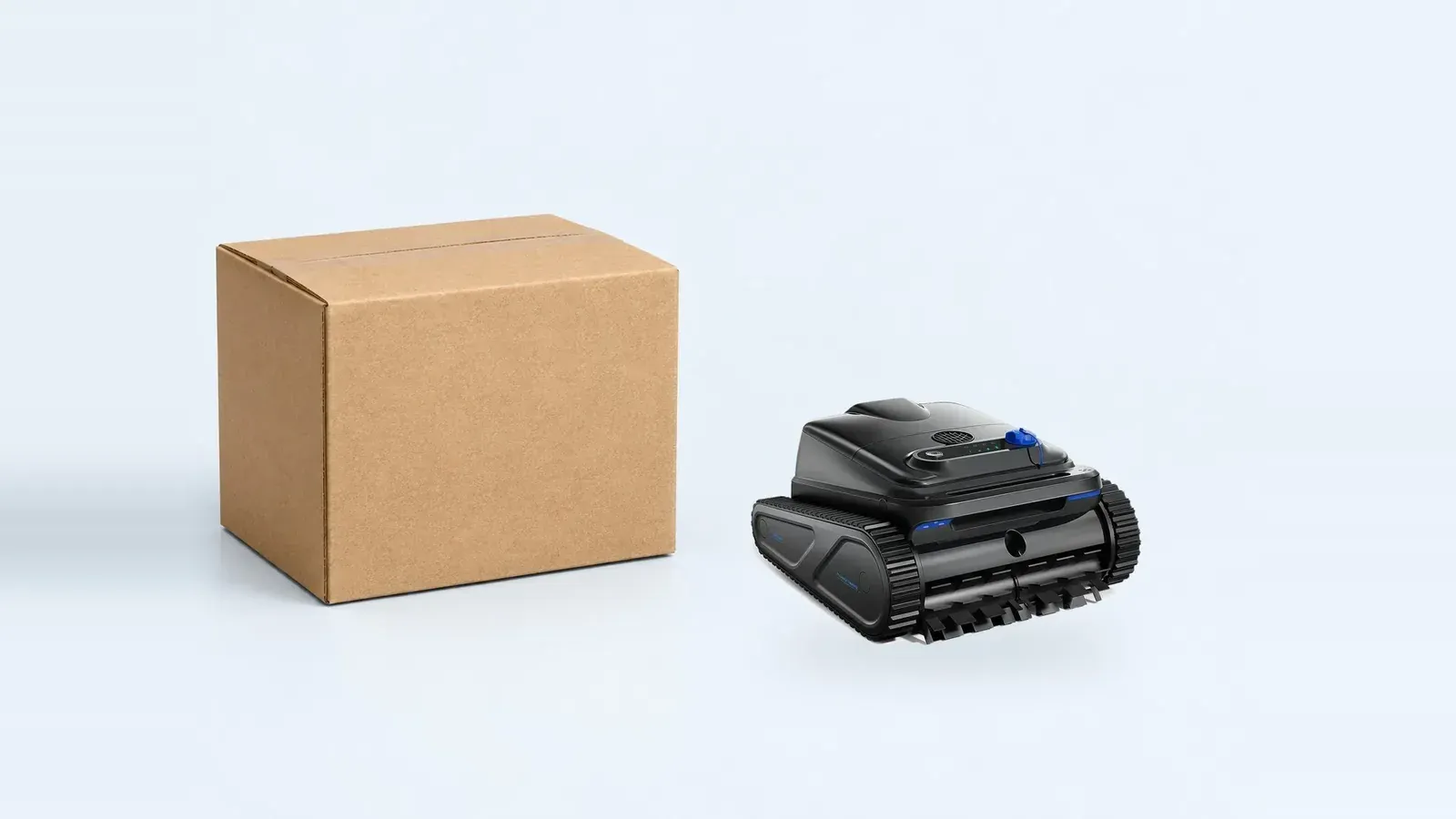 Pool robot beside a plain neutral export carton