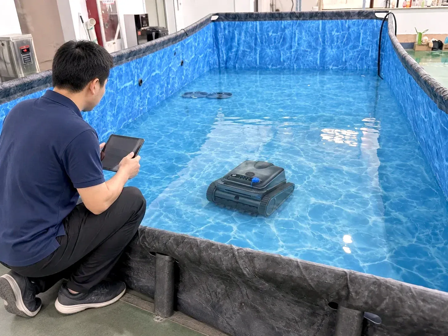 Pool robots in an in-water test tank at the Changzhou factory