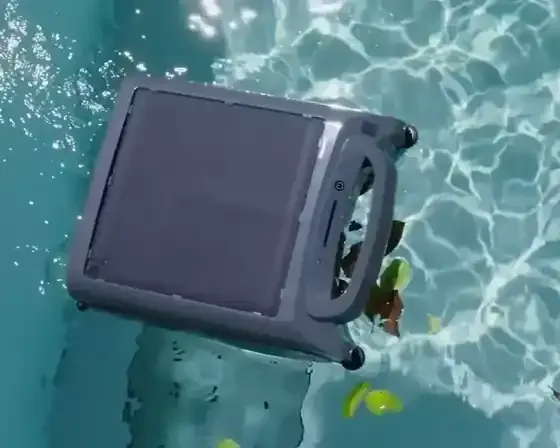 S100 solar pool skimmer drawing floating leaves into its intake and avoiding the pool wall