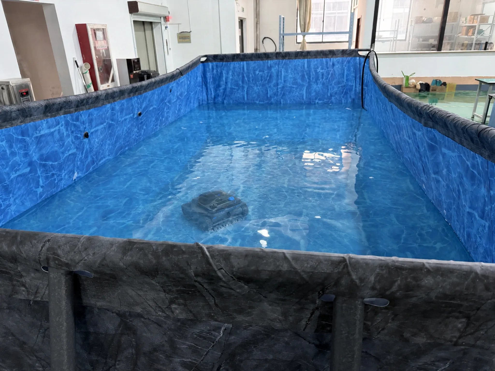 Pool robot running in the factory water test tank