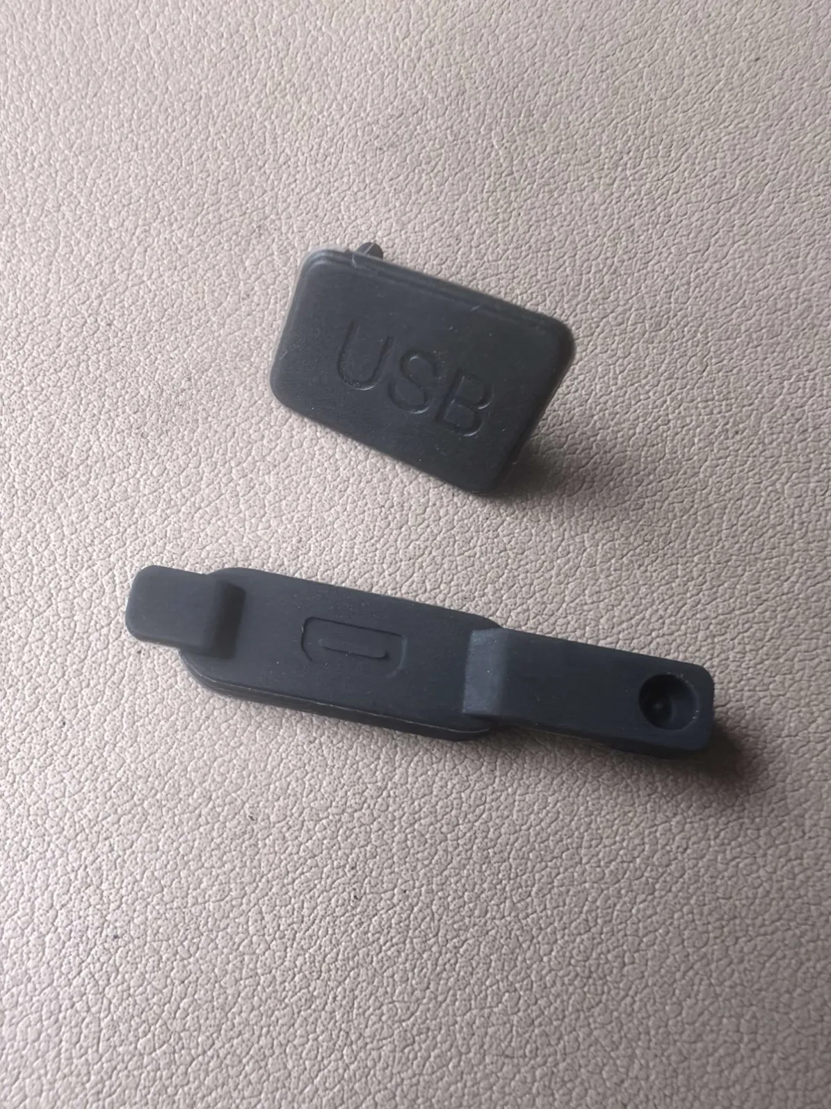 Tethered rubber USB-C dust cap with strap