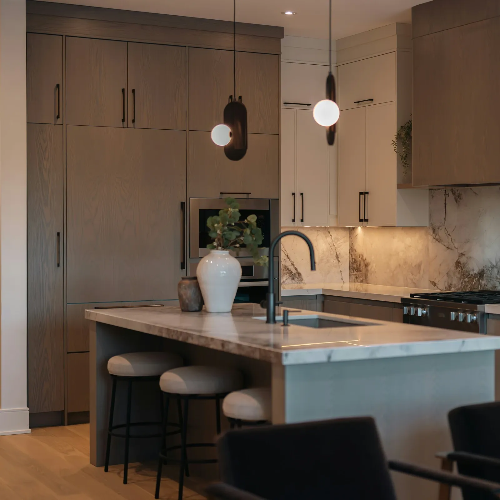Matt Black D-profile cabinet pulls fitted across kitchen cabinetry and an island in a modern kitchen