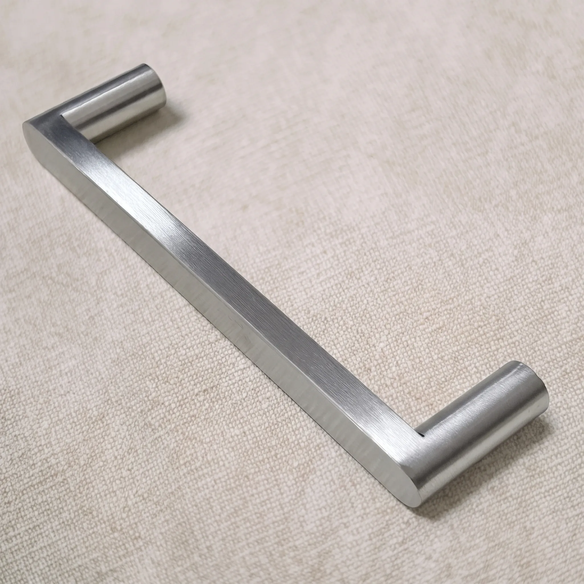 Reverse three-quarter view of the pull on linen, revealing the underside of the flat band and the end of a round leg